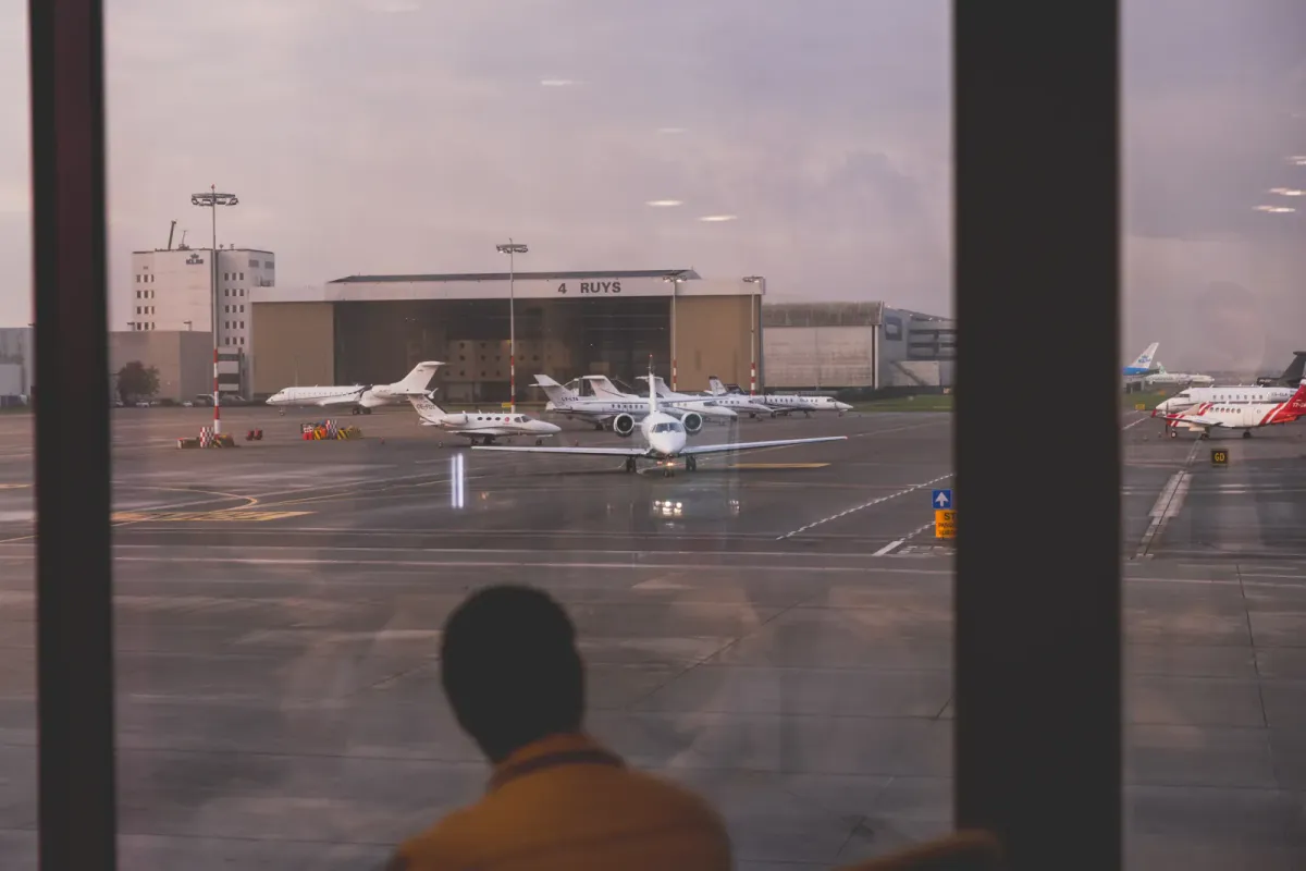Private jet parked on an airport runway