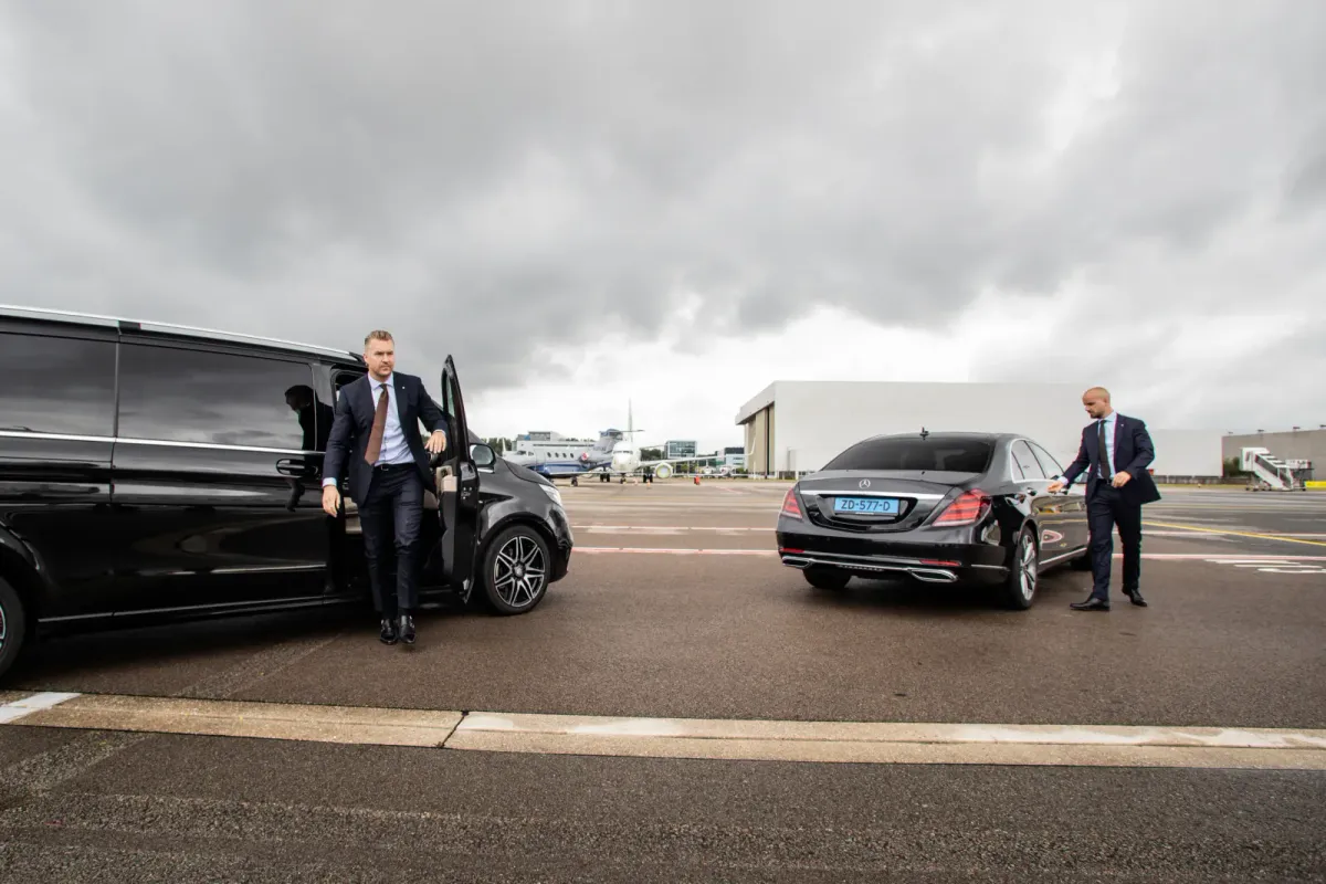 Security professionals coordinating beside a private jet