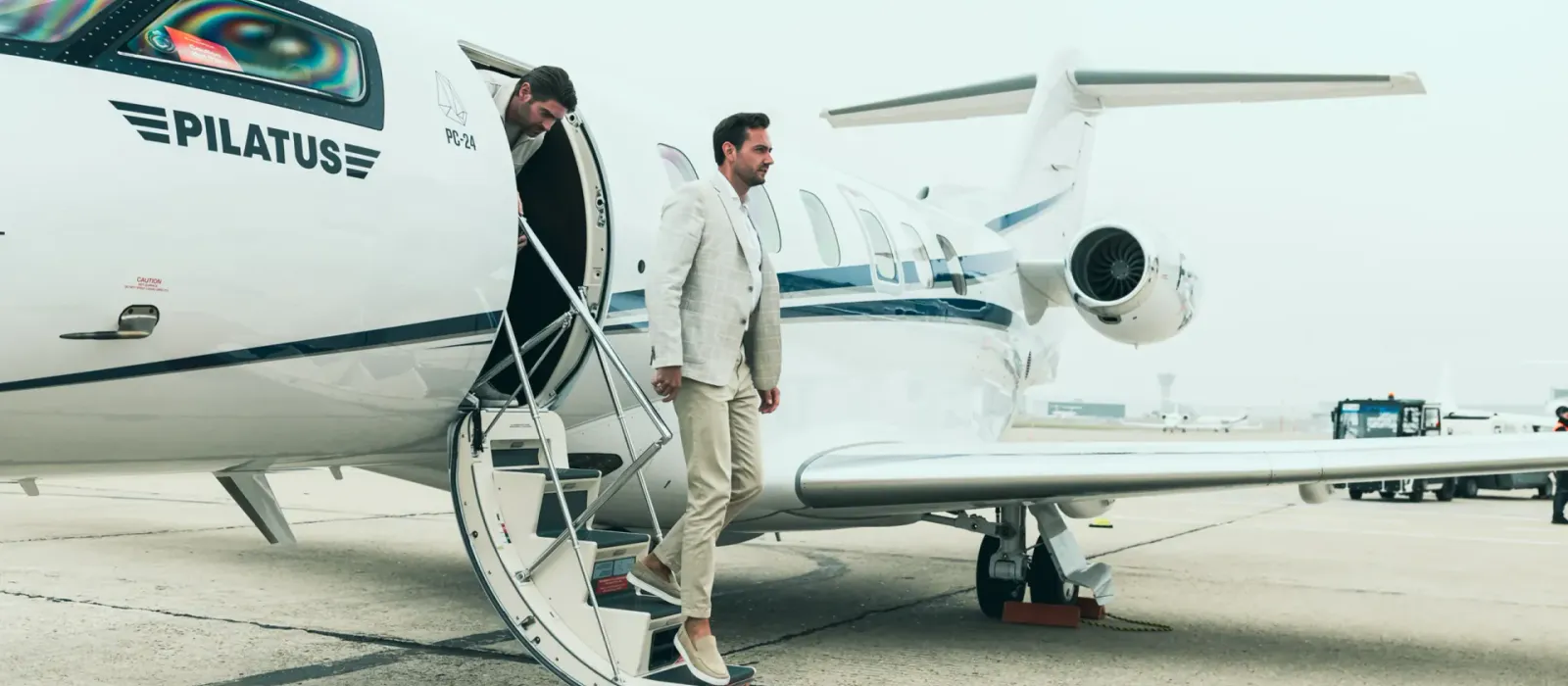 Private jet parked on an airport runway