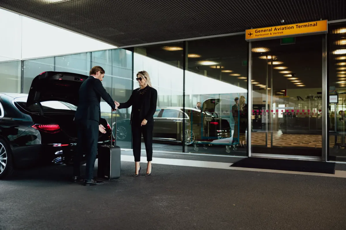 Traveller with luggage moving through an airport terminal
